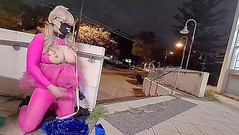 Sexy blonde with big tits is masturbating on a public