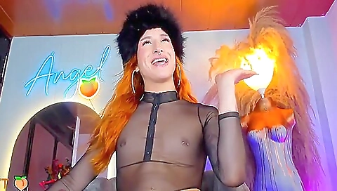 Redhead with small tits showing off her natural tits