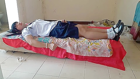 Sexy asian teen 18+ is naked and wearing a pink school dress