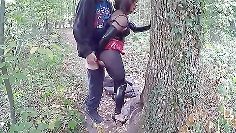 Brunette with long legs takes her ass out in the woods