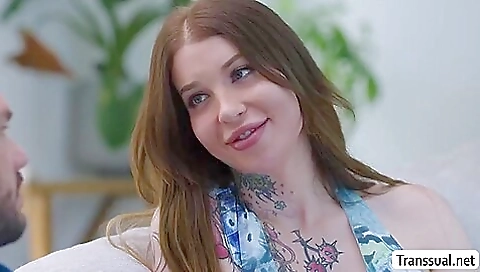 Busty shemale with big tits sucking on a huge dick